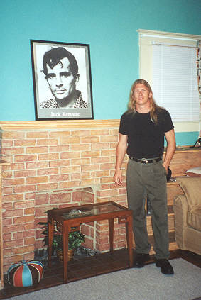 Photo:  Ray McNiece by the photo poster of Jack Kerouac